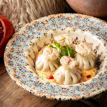 Хинкали с морепродуктами в соусе том ям